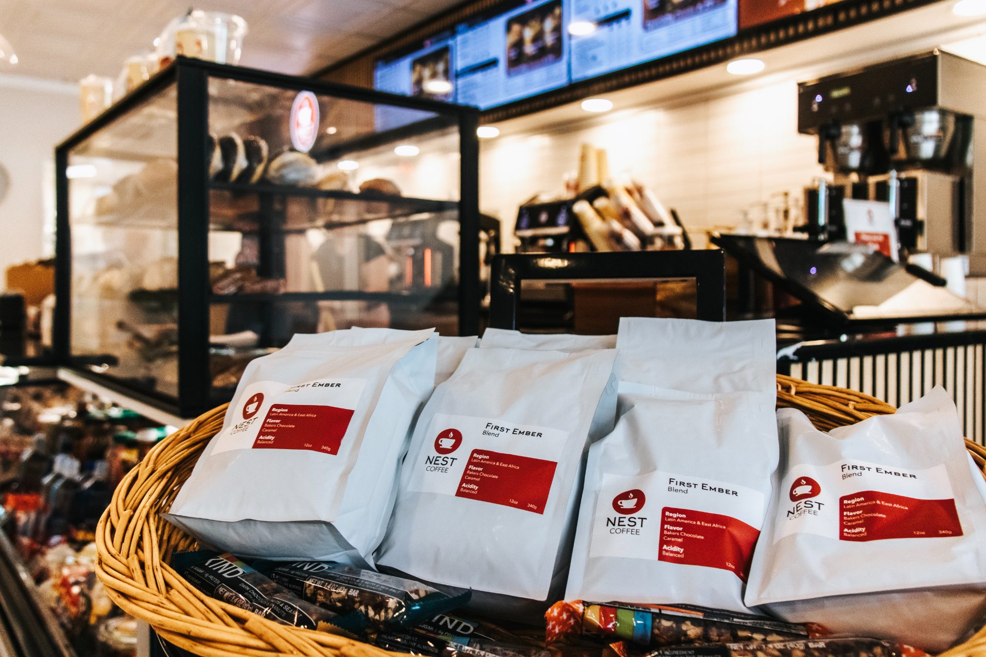 Bags of First Ember blend in a basket by the counter
